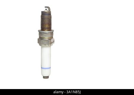 used spark plug, blue strip on body of white insulator. isolated on white background Stock Photo