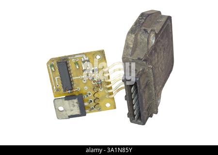 electronic ignition control module with pin blade terminal. main electronic board with hall sensor and its plastic cover. isolated on white background Stock Photo
