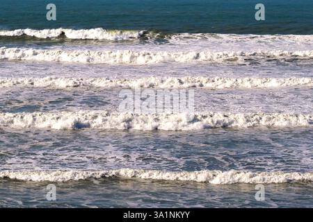 Waves rolling into a beach. No people. Stock Photo