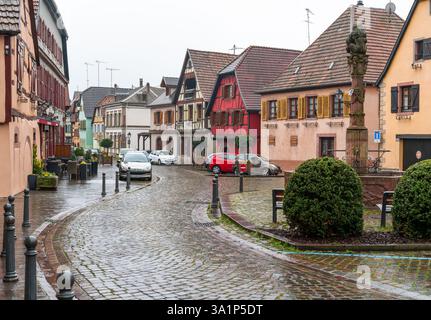 Ribeauville, Alsace, France. Small town on a rainy wet evening with empty streets and tourists hiding inside local bars. Stock Photo