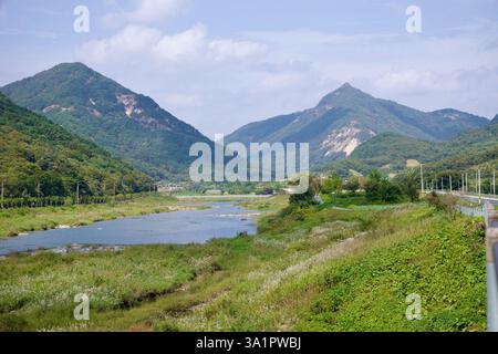 Sunchang County, South Korea - October 4, 2021: The Seomjin River flows through a lush valley, framed by Bul-am Mountain, Buldongsan, and Yonggwolsan Stock Photo