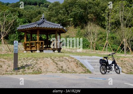 Sunchang County, South Korea - October 4, 2021: A traditional wooden rest pavilion provides shade for cyclists along the Seomjingang Bike Path, with a Stock Photo