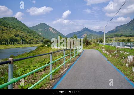 Sunchang County, South Korea - October 4, 2021: A winding stretch of the Seomjingang Bike Path runs parallel to the Seomjin River, surrounded by lush Stock Photo