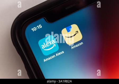 Alexa and Amazon icons are displayed on a smartphone screen ...