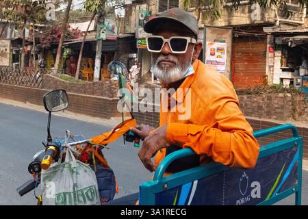 Old tuk tuk driver with retro sunglasses, Chattogram, Bangladesh Stock Photo