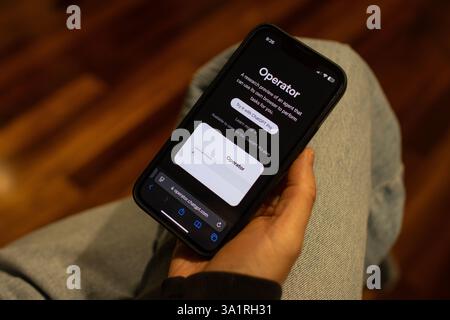 An iPhone user browses the webpage of OpenAI's Operator, an AI agent that can perform tasks on the web for users, on Sunday, March 9, 2025. Stock Photo