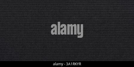 striped embossed black paper cardboard abstract background Stock Photo