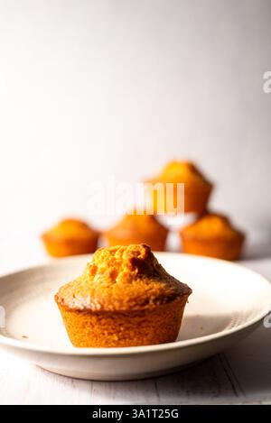 homemade lemon muffins on off white background Stock Photo