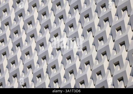 Artistic grey white 3D pattern of modern building facade in the sunlight Stock Photo