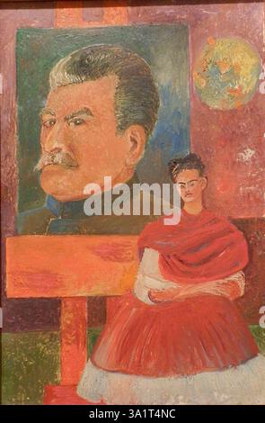 Self Portrait with Stalin, 1954. Mexican painter Frida Kahlo (1907-1954) made work inspired by the nature and artifacts of Mexico. Her naïve folk art style explored questions of identity, postcolonialism, gender, class, and race. Her paintings often had strong autobiographical elements, and mixed realism with fantasy. She has been described as a surrealist or magical realist. Found in the Collection of Banco de México Diego Rivera Frida Kahlo Museums Trust, Mexico. Stock Photo