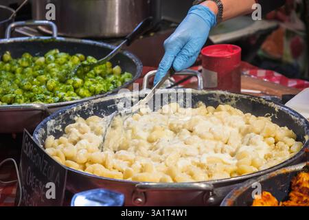 Gnocchi with creamy gorgonzola sauce on display at Brick Lane Market in London, England Stock Photo