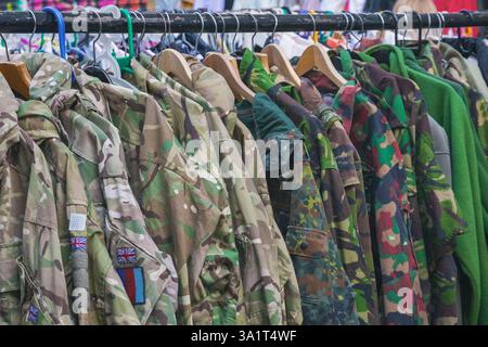 A selection of military camouflage jackets displayed at Brick Lane Market in London, England Stock Photo