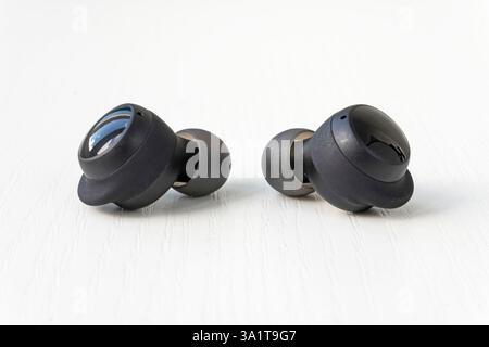 Wireless headphones on a white background. Two wireless headset closeup Stock Photo
