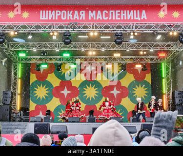 Yekaterinburg, Russia - February 26, 2025: Festive outdoor performance during Maslenitsa,traditional Slavic holiday celebrating winters end.Dancers in Stock Photo