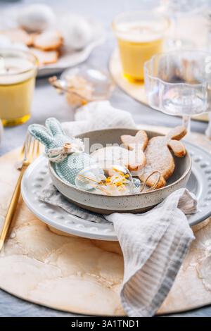 Beautiful table serving for Easter celebration in dining room Stock Photo