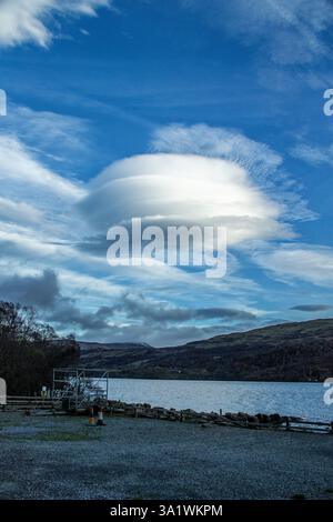 Rare Altocumulus lenticularis clouds forming over Lawers, on Loch Tay in Scotland. Stock Photo