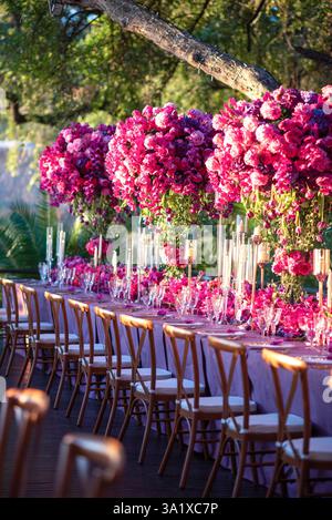 Luxurious Outdoor Wedding Reception with Stunning Floral Arrangements Stock Photo