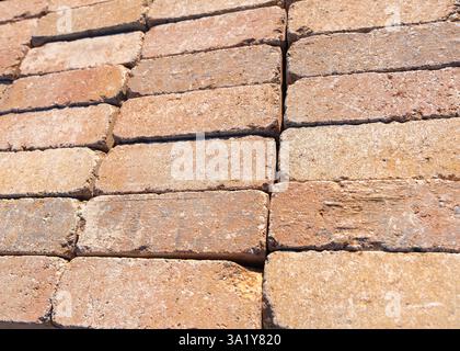 red stone under brick 6x15 cm laid out for sale . High quality photo Stock Photo