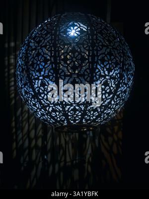 garden lantern lit up at night time Stock Photo