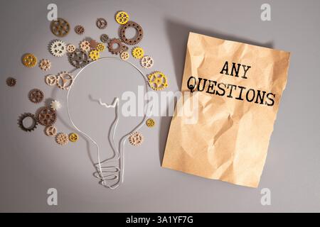Notepad with text Any Question. on yellow background. Stock Photo