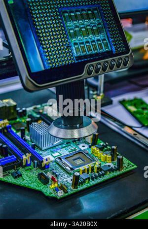 Digital microscope inspection system for checking the quality of electronic PCB circuit boards selective focus at factory Stock Photo