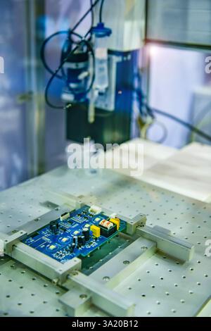 Automatic robots for assembling electronic circuit boards in factories Stock Photo