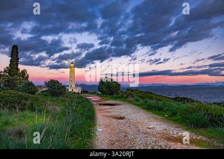 Sunset over Gytheio (Cranae) Lighthouse, during winter, in Laconia, Greece. Stock Photo