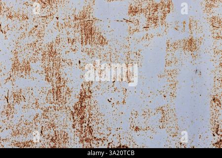Texture of a gray weathered metal surface displaying rusty brown spots and marks, ideal for use as a grunge-style background or industrial design elem Stock Photo