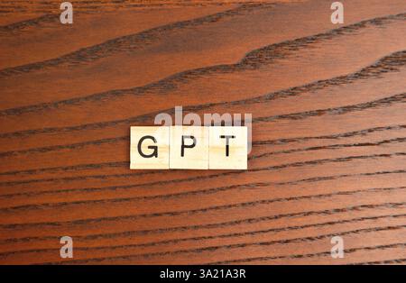 Wooden blocks with the word GPT. Generative artificial intelligence AI chatbot. New technologies concept Stock Photo