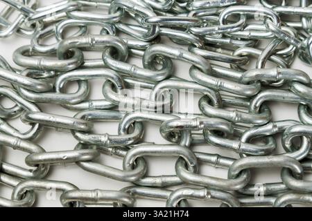 Close-up of a metal chain with space for text and white background Stock Photo