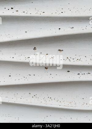 Closeup of weathered gray wavy concrete wall texture as background Stock Photo