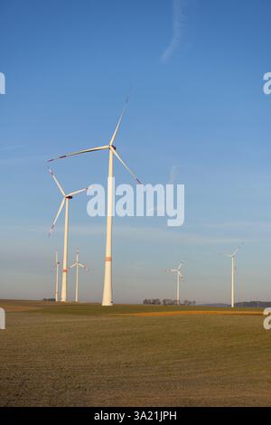 Wind turbines on the fields under a blue sky with some clouds Stock ...
