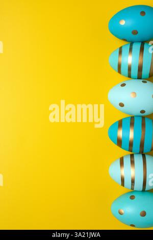 Empty yellow background with Easter eggs Stock Photo