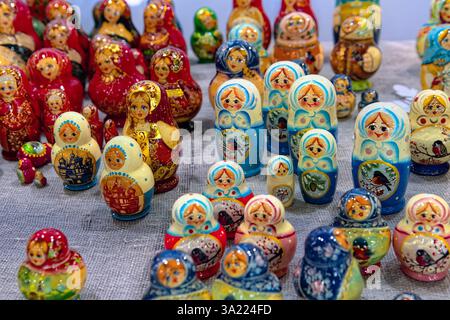 Traditional national Russian souvenirs - Russian matryoshka (wooden nesting dolls) on the counter of the gift shop. Stock Photo