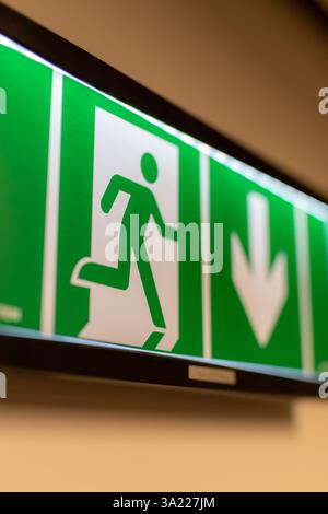 Green exit sign. Evacuation sign. Emergency exit sign. Stock Photo