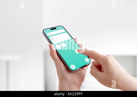 Finger dragging icons and UI elements on smartphone screen, concept of mobile app customization and interface development Stock Photo