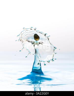 Funky looking images of two water droplets colliding making unusual shapes Stock Photo