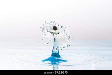 Funky looking images of two water droplets colliding making unusual shapes Stock Photo