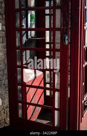 Vandalised telephone booth, Hackney, London, England, UK Stock Photo