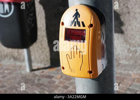 Crosswalk electronic push sensor device on a street pole in Italy Stock Photo