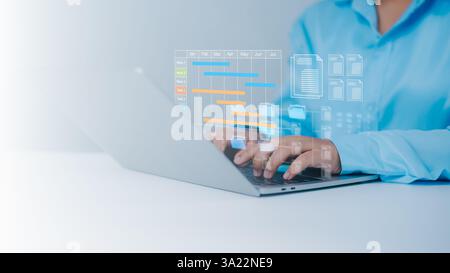 Project management tool and work schedule concept, Planning software, Businessman use laptop to manager working projects and update task with gantt ch Stock Photo