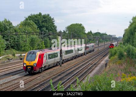 A Class 221 Virgin Voyager diesel multiple unit number 221142 heads north along the West Coast Mainline at South Kenton on the 17th August 2015. Stock Photo