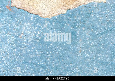 Vintage weathered blue painted wall. Peeling and cracked aged facade surface. Old distressed texture with spotted rough details. Abstract background Stock Photo