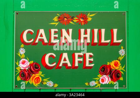 brightly coloured hand painted sign in the roses and castles barge ware style at Caen Hill locks on the kennet and Avon canal in Wiltshire, UK Stock Photo