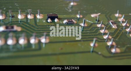 Surface mount technology for modern electronics manufacturing. Focused on surface mount transistor. Stock Photo