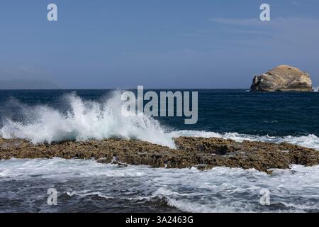 Waves breaking on rocks in Guadeloupe, Caribbean Stock Photo