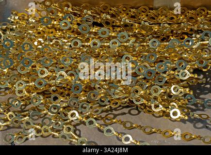 Large pile of golden copper metal electro contacts pattern tool Stock Photo
