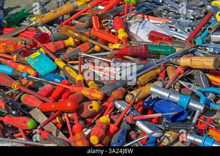 Large pile of colorful screwdrivers tools sold outside on flea market Stock Photo