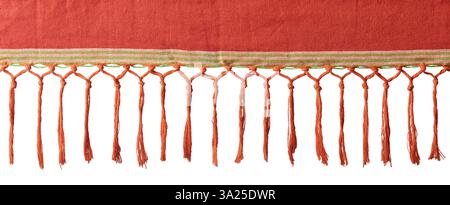 reddish orange fabric with decorative fringe isolated white background, woven texture of cotton or natural fiber made of twisted or braided threads Stock Photo
