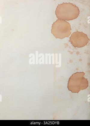 blank old piece of paper with brown stains, off white or light brown color sheet surface with coffee or tea liquid stains, taken straight from above Stock Photo